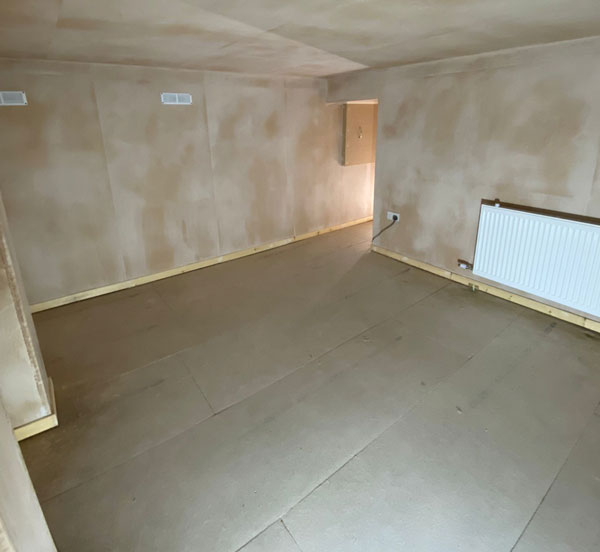 Freshly waterproofed basement in Ipswich — walls plastered and dried out