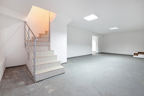 Completed cavity drain membrane system installed in a basement