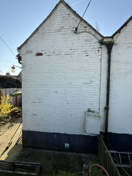 Cracked render on exterior wall allowing water ingress